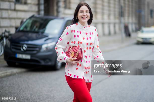 Maria Barteczko wearing white heart printed blouse Alexander McQueen, red cropped pants Alexander McQueen, white high heel sandals Giuseppe Zanotti,...