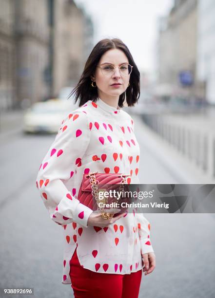 Maria Barteczko wearing white heart printed blouse Alexander McQueen, red cropped pants Alexander McQueen, white high heel sandals Giuseppe Zanotti,...