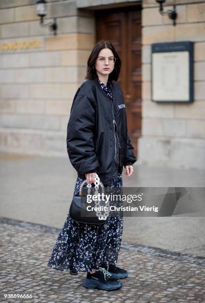 Maria Barteczko wearing long floral maxi dress Isabel Marant, black oversized bomber jacket MUF10, triple S sneaker Balenciaga, black bamboo bag...