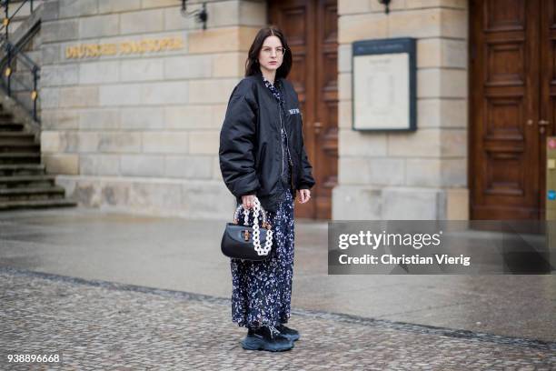 Maria Barteczko wearing long floral maxi dress Isabel Marant, black oversized bomber jacket MUF10, triple S sneaker Balenciaga, black bamboo bag...
