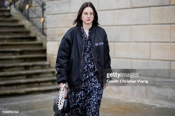 Maria Barteczko wearing long floral maxi dress Isabel Marant, black oversized bomber jacket MUF10, triple S sneaker Balenciaga, black bamboo bag...