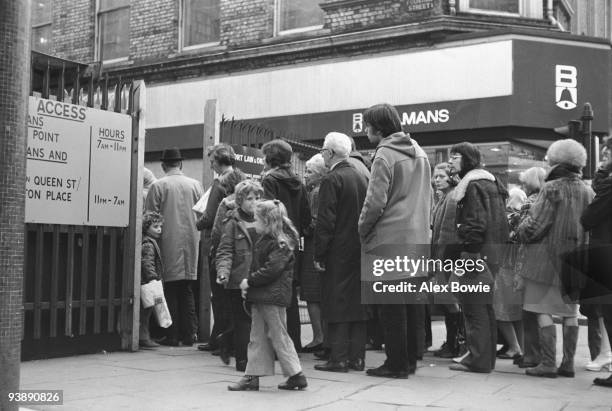 Businessmen and shoppers queue at Fountain Street to enter Belfast city centre, 7th April 1972. The so-called 'ring of steel' security cordon...