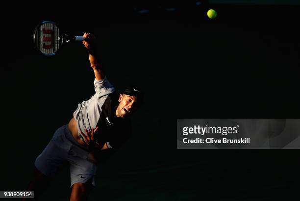 Borna Coric of Croatia serves against Denis Shapovalov of Canada in their fourth round match during the Miami Open Presented by Itau at Crandon Park...