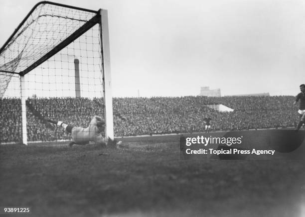Manchester United stiker George Stacey scores a penalty during a league match against Manchester United at Old Trafford, 4th October 1913. Manchester...