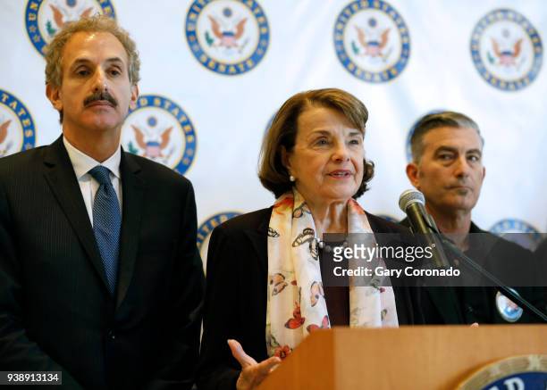 Sen. Dianne Feinstein, center, shown with Mike Feuer, left, Los Angeles District Attorney, and Paul Wilson, gun control advocate, holds a press...