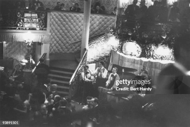 John Kerrison's rhumba-style band plays on a busy evening at the Cafe de Paris nightclub in London, February 1951. Original publication: Picture Post...