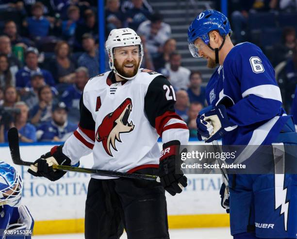 Anton Stralman of the Tampa Bay Lightning skates against Derek Stepan the Arizona Coyotes during second period at Amalie Arena on March 26, 2018 in...