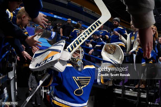 Carter Hutton of the St. Louis Blues greets fans before taking the ice for warmups against the San Jose Sharks at Scottrade Center on March 27, 2018...