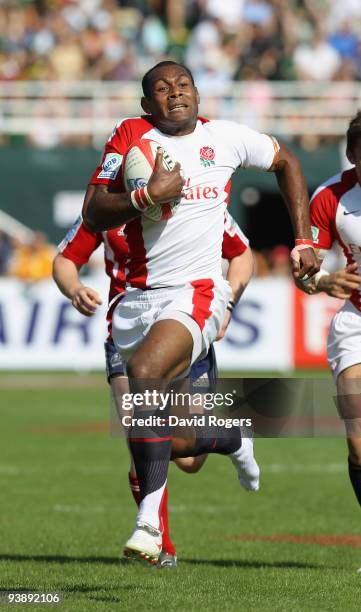 Isoa Damu of England races away to score a try against Russia during the IRB Sevens tournament at the Dubai Sevens Stadium on December 4, 2009 in...