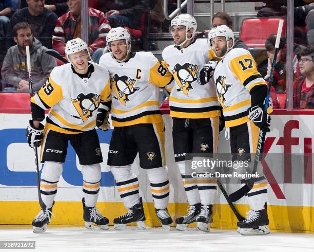 Sidney Crosby of the Pittsburgh Penguins celebrates his first period goal with teammates Jake Guentzel, Justin Schultz and Bryan Rust during an NHL...