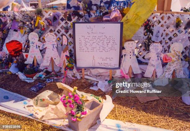 View of flowers and tokens left at a makeshift memorial in remembrance of 13 victims at Columbine High School, Littleton, Colorado, April 21, 1999....