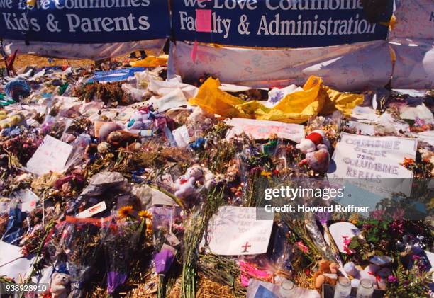 View of flowers and tokens left at a makeshift memorial in remembrance of 13 victims at Columbine High School, Littleton, Colorado, April 21, 1999....