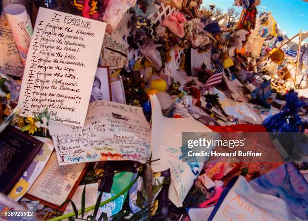 View of flowers and tokens left at a makeshift memorial in remembrance of 13 victims at Columbine High School, Littleton, Colorado, April 21, 1999....