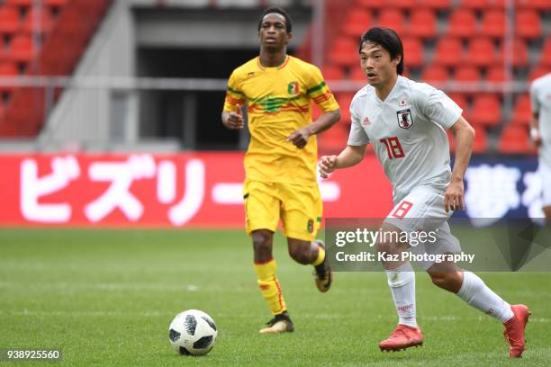 Shoya Nakajima of Japan dribbles the ball during the International friendly match between Japan and Mali at the Stade de Sclessin on March 23, 2018...