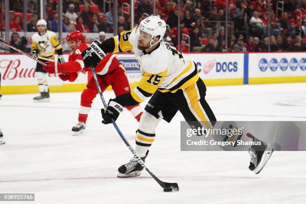 Riley Sheahan of the Pittsburgh Penguins takes a first period shot while playing the Detroit Red Wings at Little Caesars Arena on March 27, 2018 in...