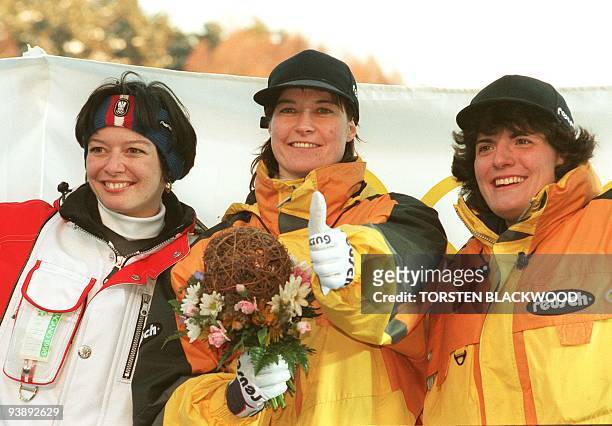 Medalists in the women's single luge event of the Nagano Olympics, gold, Silke Kraushaar of Germany ; silver, compatriot Barbara Niedernhuber and...