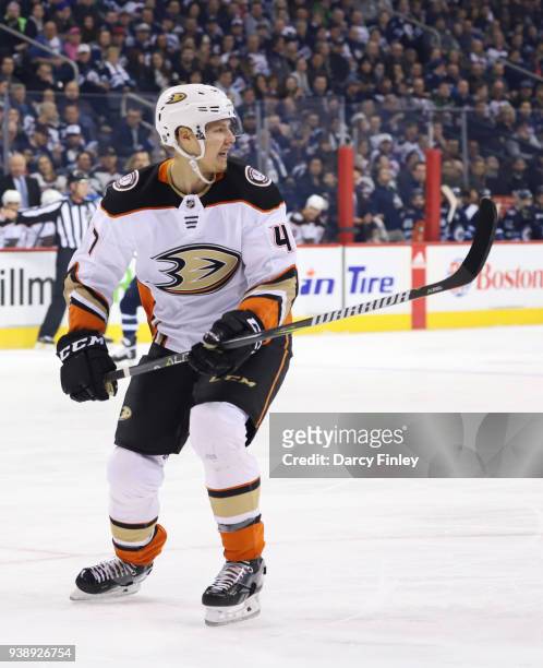 Hampus Lindholm of the Anaheim Ducks keeps an eye on the play during first period action against the Winnipeg Jets at the Bell MTS Place on March 23,...