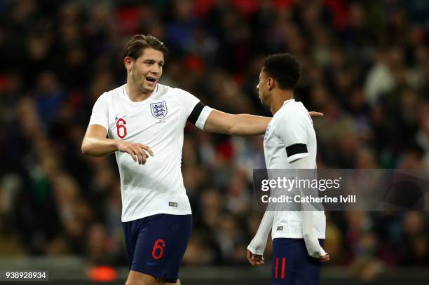 James Tarkowski of England talks to Jesse Lingard during the International Friendly match between England and Italy at Wembley Stadium on March 27,...