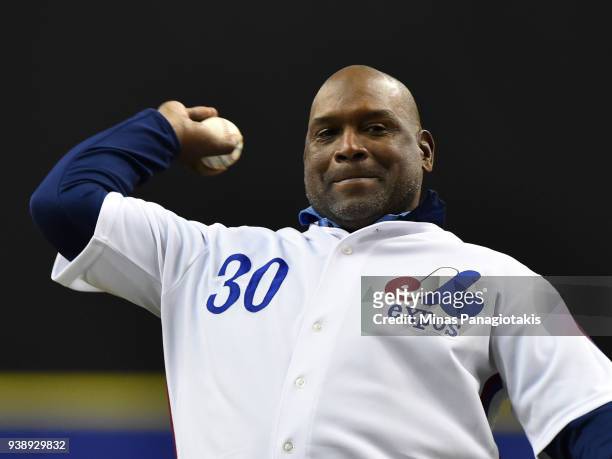 Former left fielder for the Montreal Expos Tim Raines throws the opening pitch during the pregame ceremony between the Toronto Blue Jays and the St....