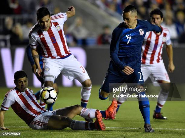 Bobby Wood of United States battles Bruno Valdez and Gustavo Gomez of Paraguay for the ball during their game at WakeMed Soccer Park on March 27,...