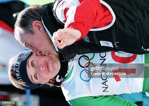 Australia's Zali Steggall gets a kiss from a team member 19 February after the Olympic women's slalom at Mt. Yakebitai in Shiga Kogen 19 February....