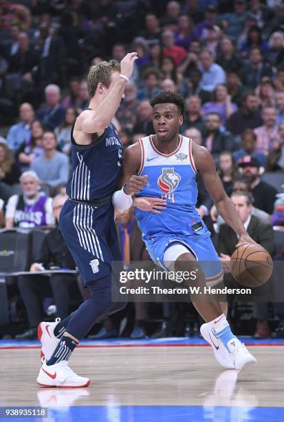 Buddy Hield of the Sacramento Kings drives on Luke Kennard of the Detroit Pistons during an NBA basketball game at Golden 1 Center on March 19, 2018...