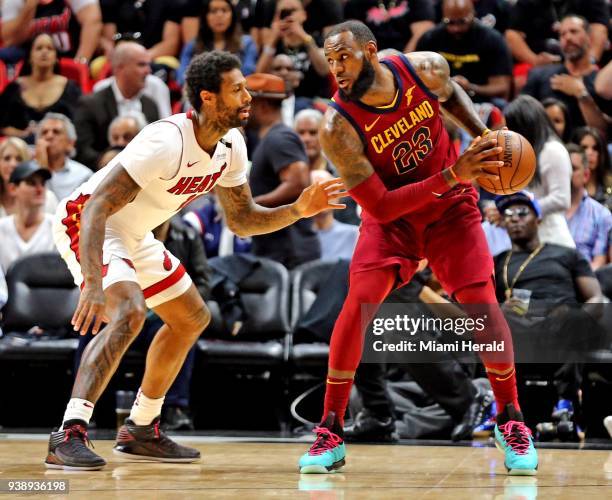 The Miami Heat's James Johnson, left, guards the Cleveland Cavaliers' LeBron James in the first quarter at the AmericanAirlines Arena in Miami on...