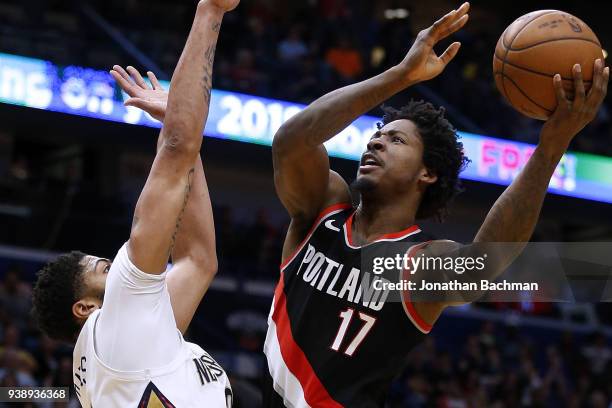 Ed Davis of the Portland Trail Blazers shoots against Anthony Davis of the New Orleans Pelicans during the first half at the Smoothie King Center on...