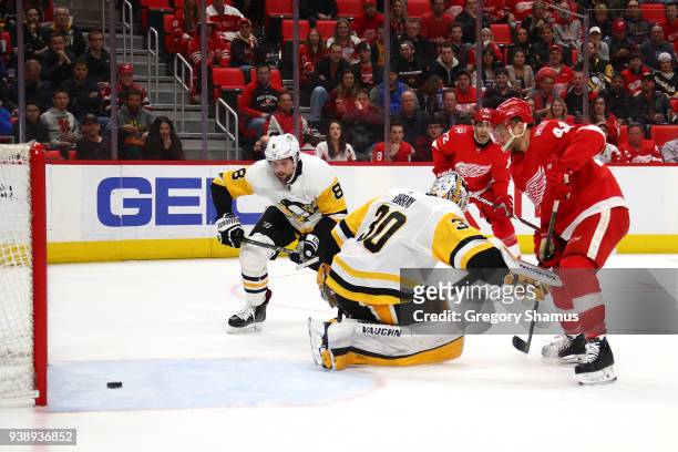 Luke Glendening of the Detroit Red Wings watches a second period goal go in after getting past Matt Murray of the Pittsburgh Penguins at Little...