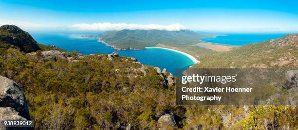 the hazards and wineglass bay - wine glass bay tasmania stock pictures, royalty-free photos & images