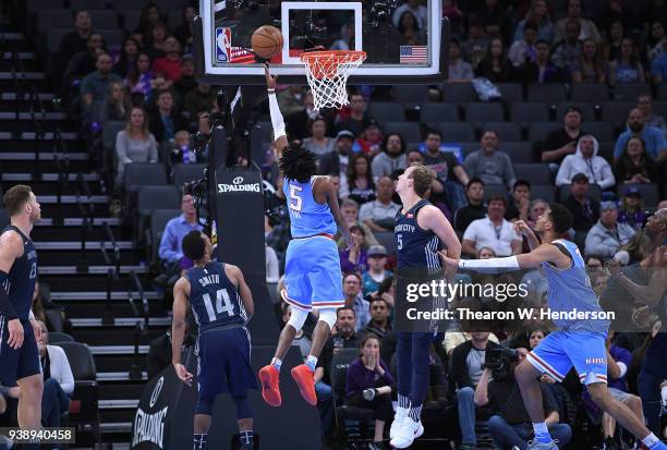 De'Aaron Fox of the Sacramento Kings goes in for a layup over Luke Kennard of the Detroit Pistons during an NBA basketball game at Golden 1 Center on...