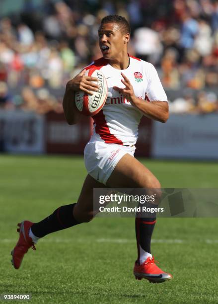 Dan Caprice of England races away to score a try against Russia during the IRB Sevens tournament at the Dubai Sevens Stadium on December 4, 2009 in...