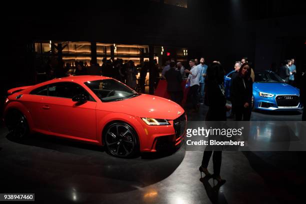 The Audi AG TT RS, left, and RS3, right, sport vehicles sit on display during an event in New York, U.S., on Tuesday, March 27, 2018. Audi is heavily...