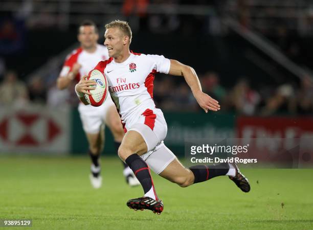 Nick Royle of England races away to score a try against Kenya during the IRB Sevens tournament at the Dubai Sevens Stadium on December 4, 2009 in...