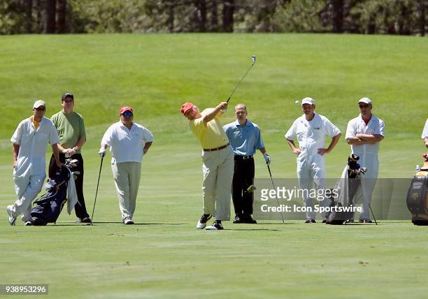 Businessman Donald Trump hits a ball from the fairway during the 2006 American Century Celebrity Golf Tournament played at the Edgewood Tahoe golf...