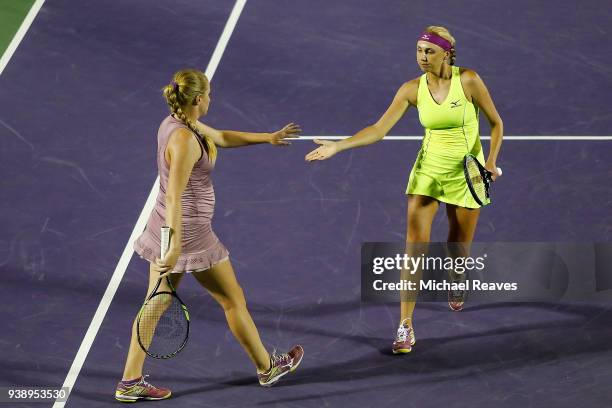 Lyudmyla Kichenok of Ukraine and Alla Kudryavtseva of Russia celebrate after a point against Ekaterina Makarova and Elena Vesnina of Russia during...