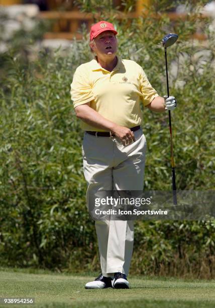 Businessman Donald Trump watches his drive during the 2006 American Century Celebrity Golf Tournament played at the Edgewood Tahoe golf course in...