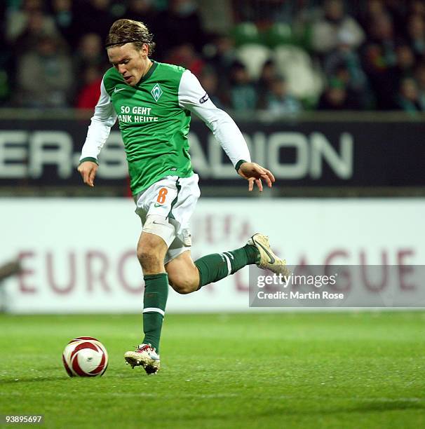 Clemens Fritz of Bremen runs with the ball during the UEFA Europa League Group L match between Werder Bremen and CD Nacional at Weser Stadium on...