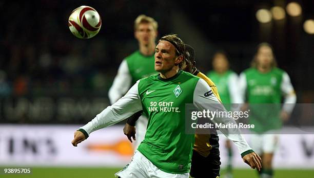 Clemens Fritz of Bremen runs with the ball during the UEFA Europa League Group L match between Werder Bremen and CD Nacional at Weser Stadium on...