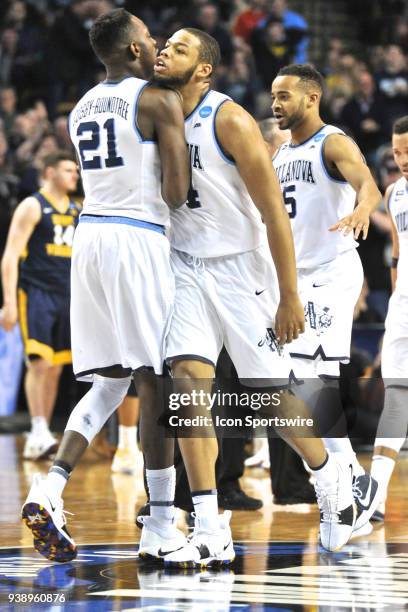 Villanova Wildcats forward Omari Spellman and Villanova Wildcats forward Dhamir Cosby-Roundtree give each other a chest bump after a good play....