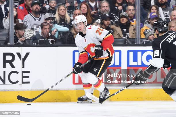 Nick Shore of the Calgary Flames handles the puck during a game against the Los Angeles Kings at STAPLES Center on March 26, 2018 in Los Angeles,...