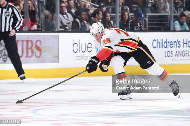 Michael Stone of the Calgary Flames controls the puck during a game against the Los Angeles Kings at STAPLES Center on March 26, 2018 in Los Angeles,...
