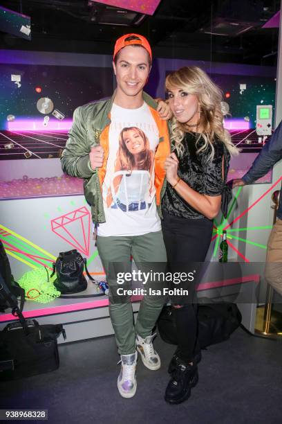 German singer Julian David and German singer Annemarie Eilfeld during the 'VIP 90's Let's Glow' Opening Party at Madame Tussauds on March 27, 2018 in...