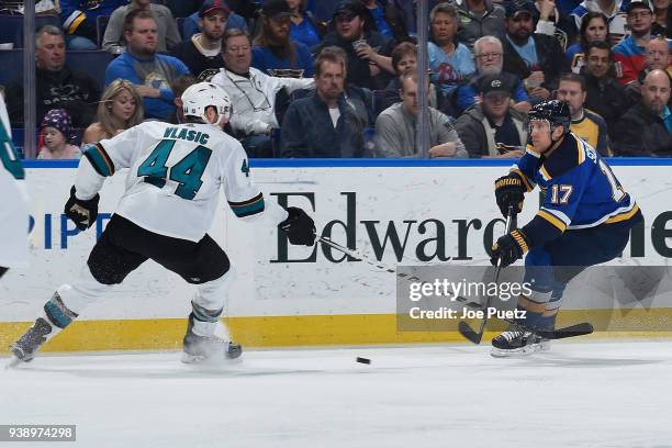 Marc-Edouard Vlasic of the San Jose Sharks defends against Jaden Schwartz of the St. Louis Blues at Scottrade Center on March 27, 2018 in St. Louis,...