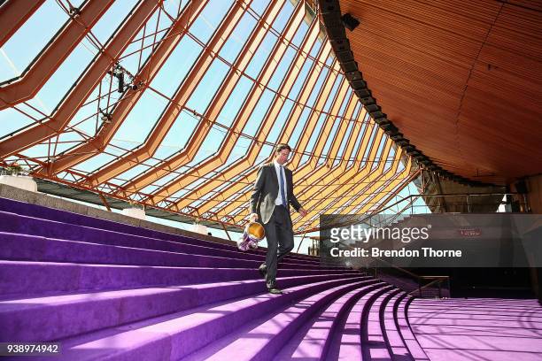 Gillon McLachlan walks down stairs inside the Sydney Opera House with the 2018 AFL Premiership Cup during the NSW Celebration of the 2018 Toyota AFL...