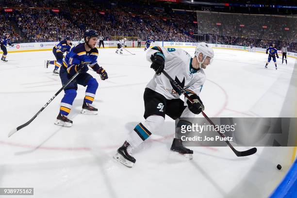 Mikkel Boedker of the San Jose Sharks handles the puck as Vladimir Sobotka of the St. Louis Blues pressures at Scottrade Center on March 27, 2018 in...