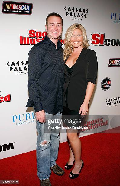 Kurt Busch and wife Eva arrive at Sports Illustrated's Club SI NASCAR at PURE Nightclub at Caesars Palace on December 3, 2009 in Las Vegas, Nevada.