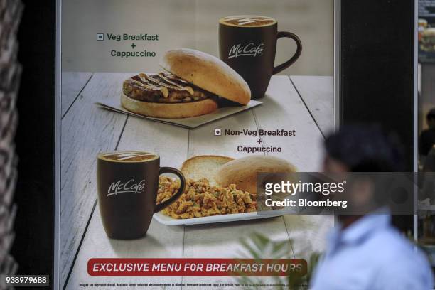 Breakfast menu items are displayed in the window of a McDonald's Corp. Restaurant, operated by Hardcastle Restaurants Pvt., in Mumbai, India, on...