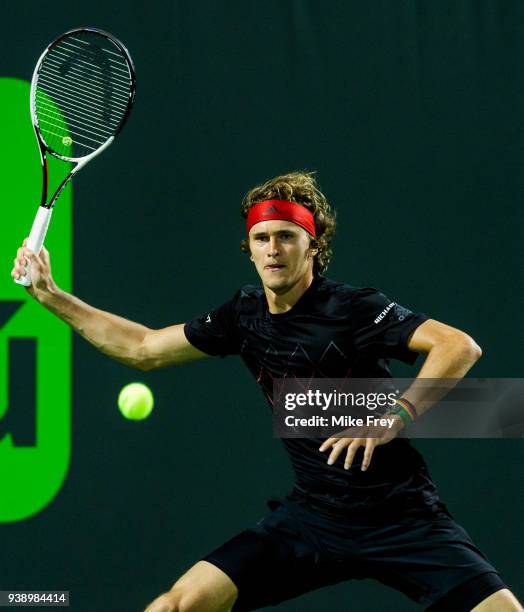 Alexander Zverev of Germany hits a forehand to Nick Kyrgios of Australia during Day 9 of the Miami Open Presented by Itau at Crandon Park Tennis...