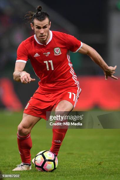 Gareth Bale of Wales national football team kicks the ball to make a pass against Uruguay national football team in their final match during the 2018...